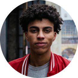 A young man in a red jacket