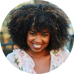 Smiling woman with dark curls